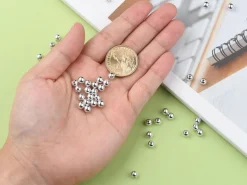 100 perles en plastique rondes - 6 mm - argenté