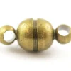 1 petit fermoir aimanté rond - couleur bronze