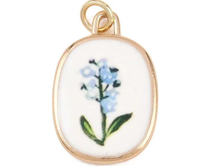 Breloque ovale fleur bleue - laiton doré clair