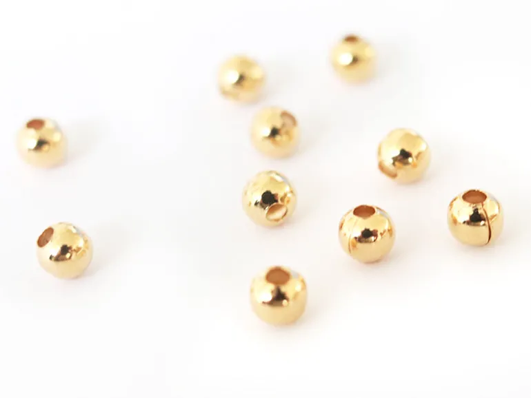 Lot de 50 perles rondes 4mm - dorées à l'or fin