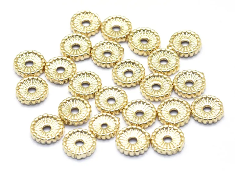 Perle rondelle ethnique 7 x 1,5 mm - dorée à l'or fin